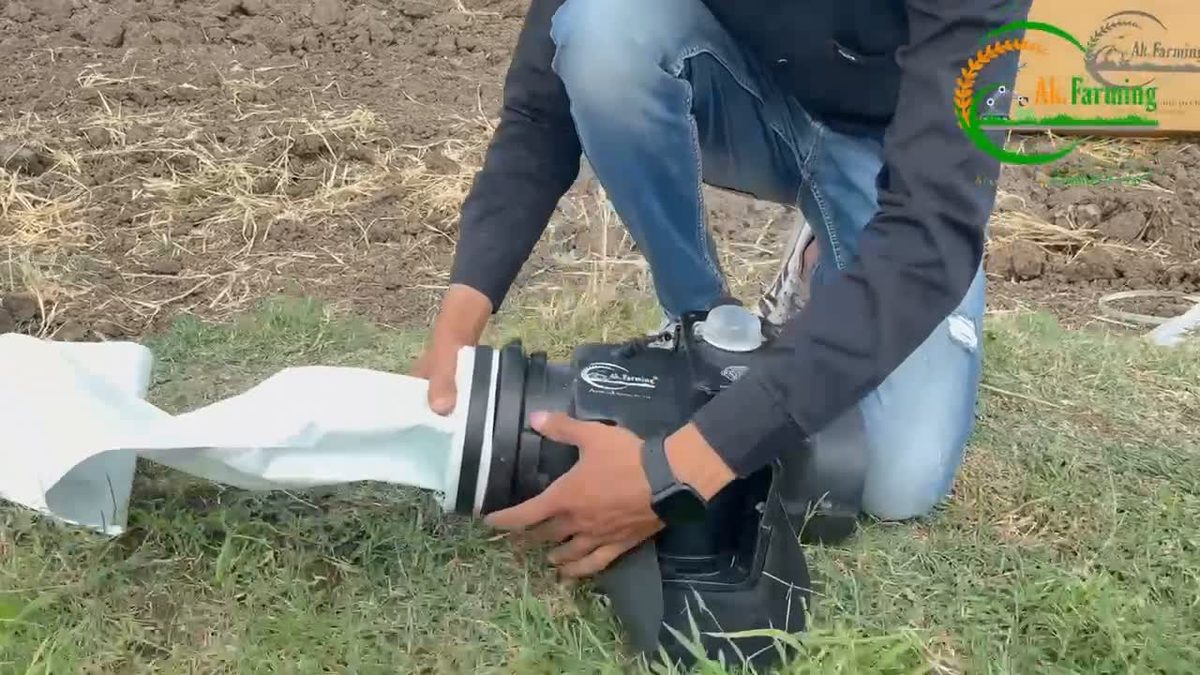 Farmer irrigating a field in India